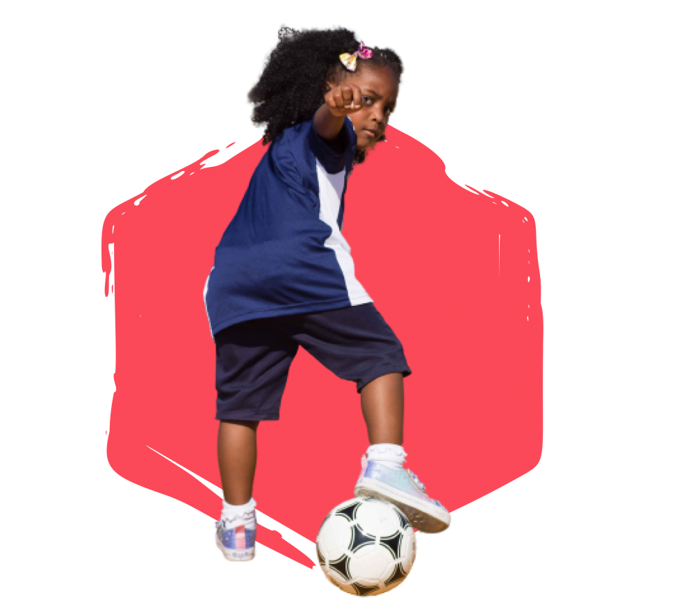 Girl with her foot on a soccer ball pointing to the camera